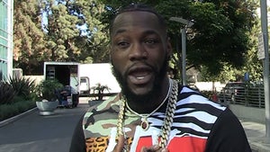 Deontay Wilder Wears Massive Gold Chain to Train His Neck, 'It's So Heavy!'