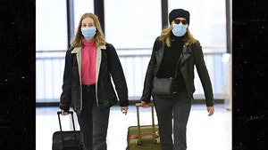 Felicity Huffman & Daughter Wear Masks at Airport Amid Coronavirus Scare