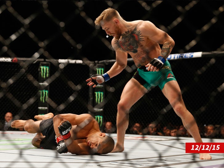 Conor McGregor punches Jose Aldo sub getty