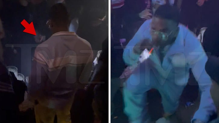 Rapçi Nelly, Kafasına Atıldıktan Sonra Miami Kulübünde Uzaklaşıyor