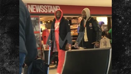 031517_meek_mill_leaving_airport_kal