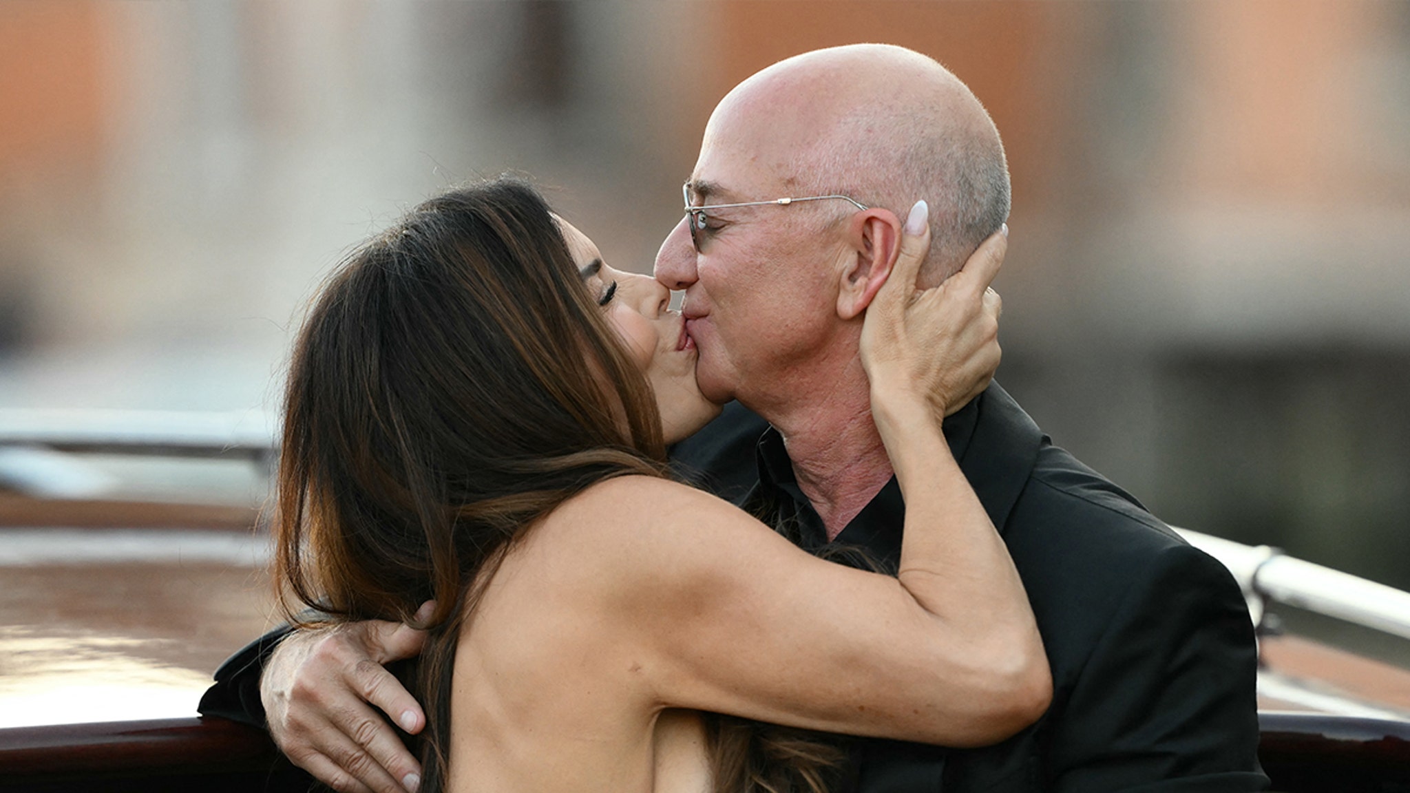 Lauren Sanchez, Jeff Bezos Kiss on Water Taxi After Tying the Knot