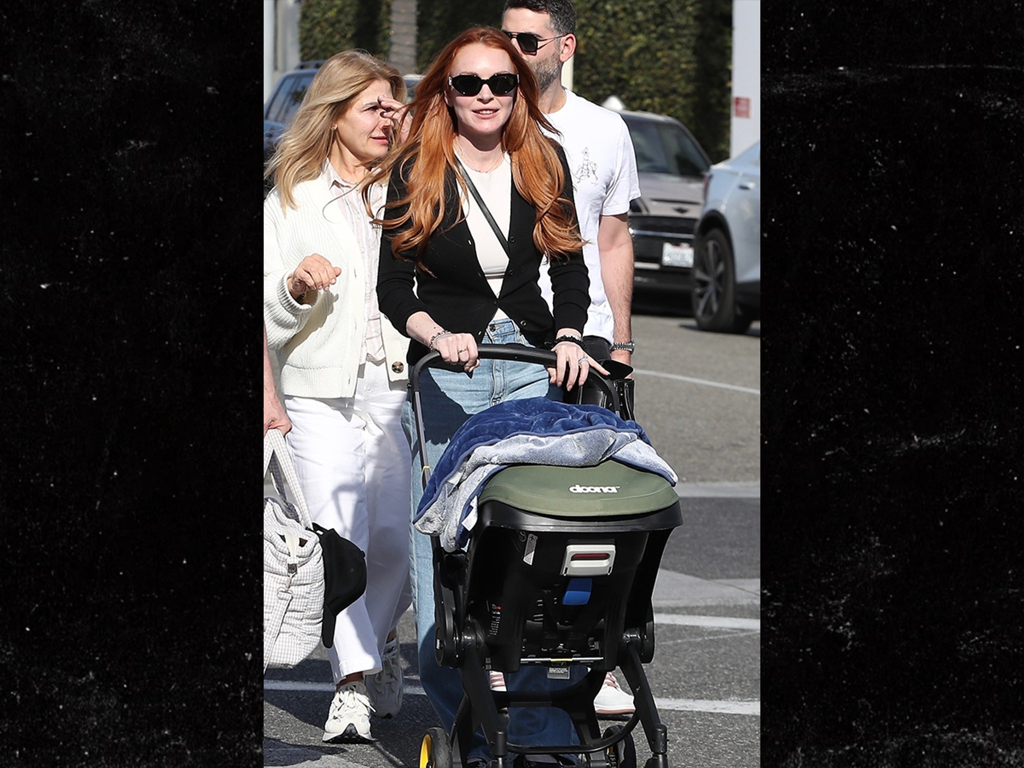 Lindsay Lohan Pushes Baby Stroller with Husband in Beverly Hills