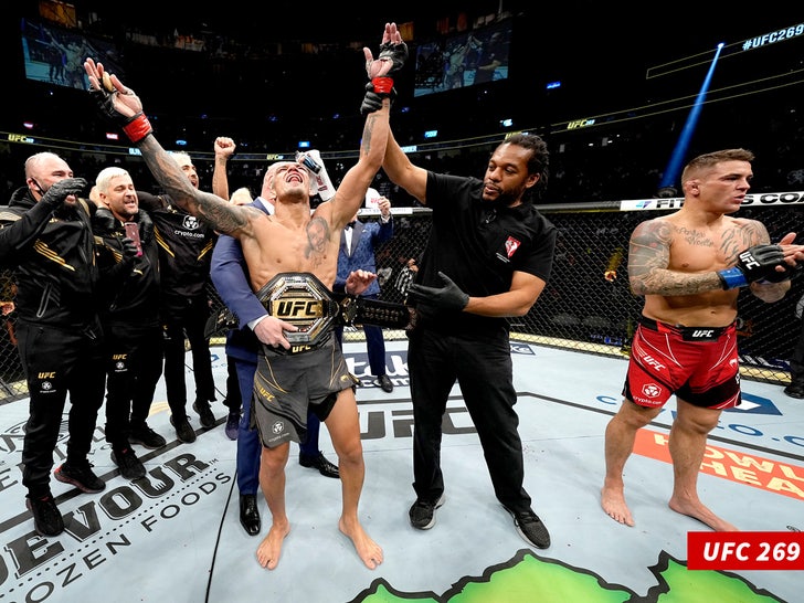 Charles Oliveira of Brazil reacts after being announced the winner by submission against Dustin Poirier
