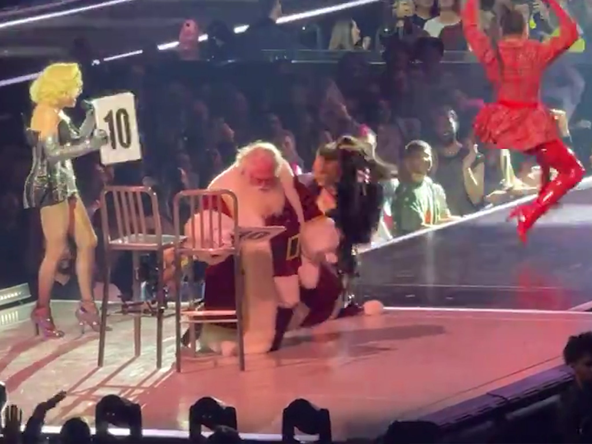 Santa Gets Lap Dance at Madonna Show, Falls Off Chair