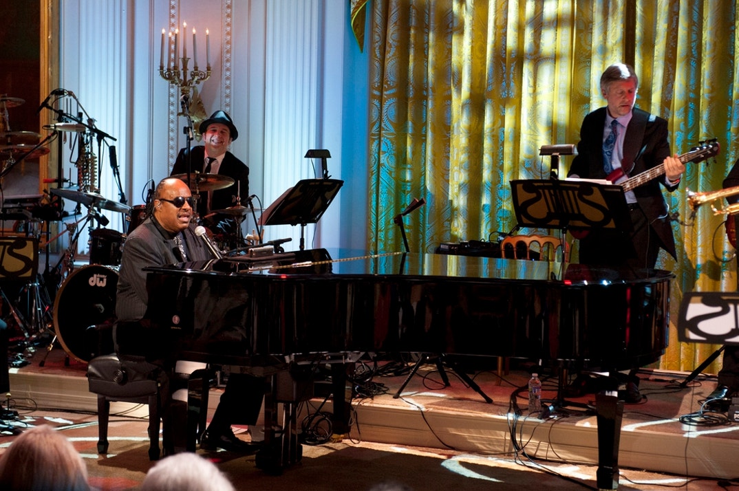 Stevie Wonder performs for the First Family and guests during a concert honoring Gershwin Prize winners Burt Bacharach and Hal David in the East Room at the White House in Washington on May 9, 2012 in Washington, DC. Burt Bacharach along with Hal David, were awarded the 2012 Library of Congress Gershwin Prize for Popular Song.