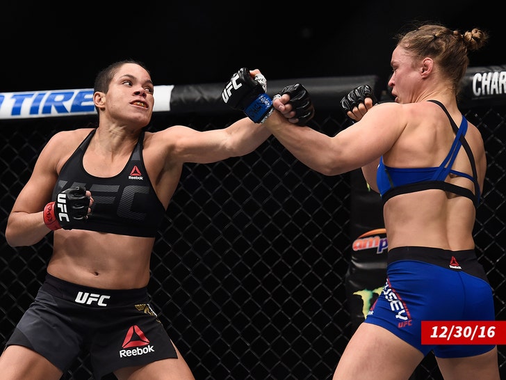 Amanda Nunes of Brazil punches Ronda Rousey getty
