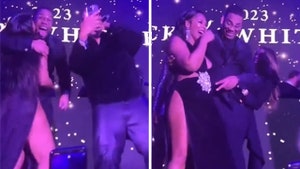 Nelly & Ashanti Spark Pregnancy Rumors With Onstage Belly Rub