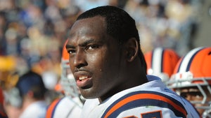 Arthur Jones Is seen at a football game. He's wearing a white, blue, and orange jersey, with the number 97 on his left shoulder.