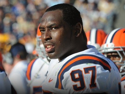 Arthur Jones Is seen at a football game. He's wearing a white, blue, and orange jersey, with the number 97 on his left shoulder.