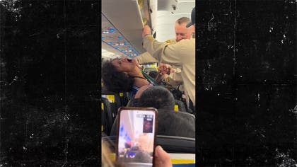 040324-woman-arrested-spirit-airlines-kal