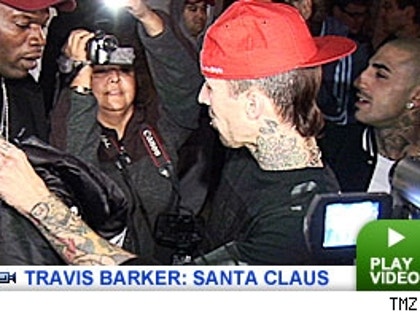 Travis Barker plays Santa