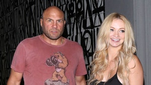 0908 randy couture mindy robinson getty 01