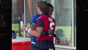 Jaxson Dart and Abdul Carter embrace x