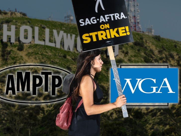strike picketing and the amptp logo and wga logo