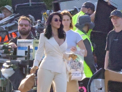 Kim Kardashian Shooting Alls Fair Ferrari White Suit photos 2 3