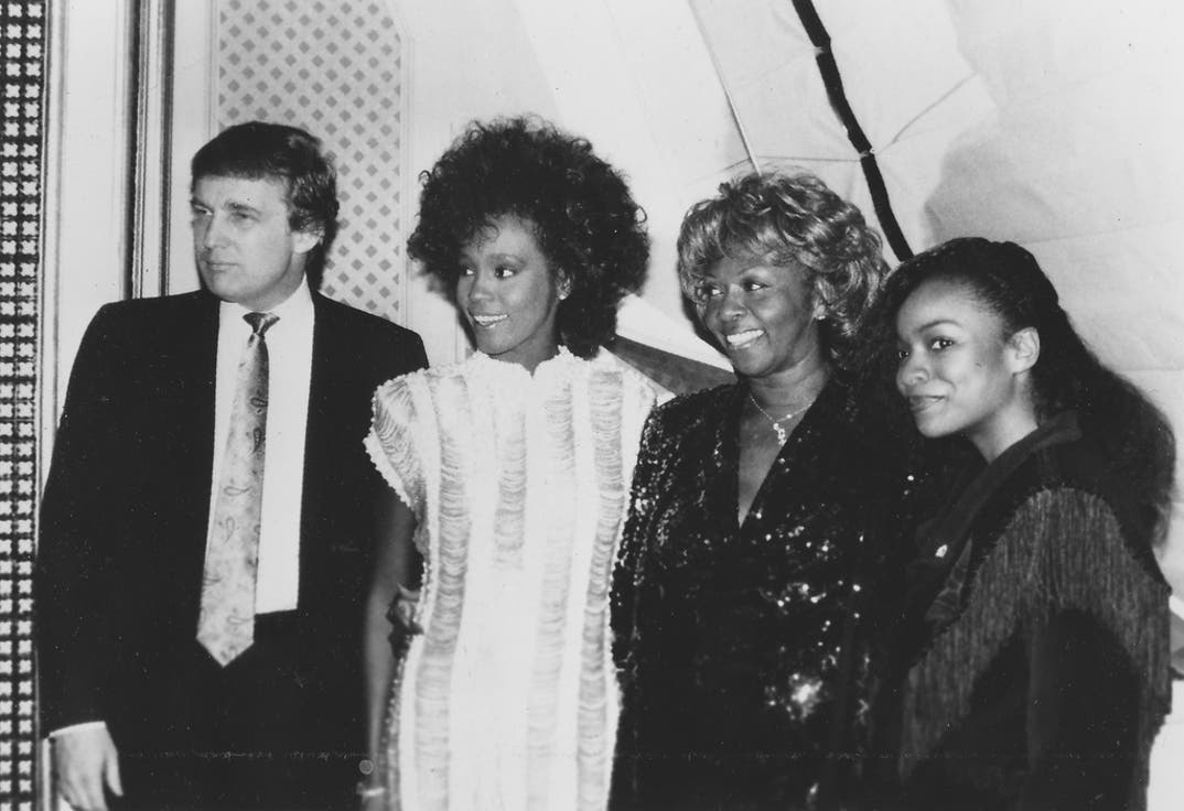 Donald Trump, Whitney Houston, and Cissy Houston posing for a group photo in San Francisco.