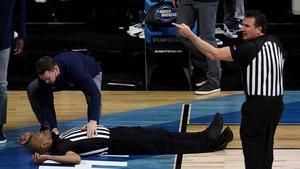 NCAA Referee Bert Smith Collapses On Court During Elite 8 Game, But Seems Okay