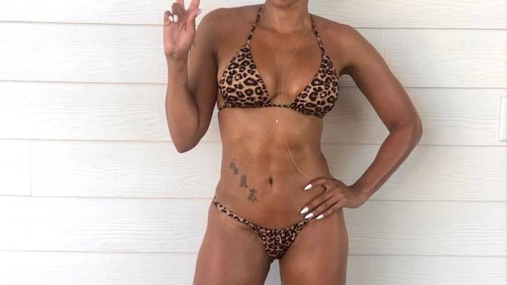 Guess Which Pop Star Shared This Bikini Selfie at 49 Years Old!