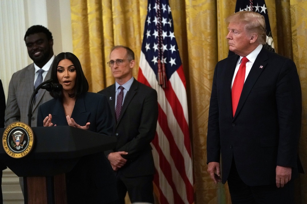 Kim Kardashian West speaks as U.S. President Donald Trump listens during an East Room event on “second chance hiring” June 13, 2019 at the White House in Washington, DC. President Donald Trump held the event to highlight the achievements on Second Chance hiring and workforce development.