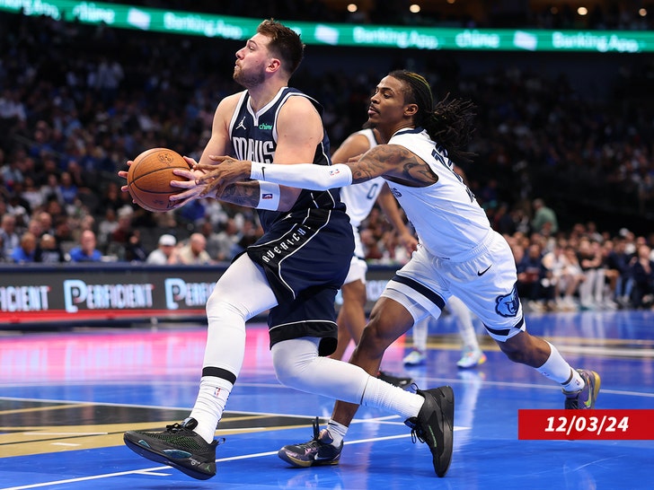 Luka Doncic #77 of the Dallas Mavericks drives with the ball past Ja Morant #12 of the Memphis Grizzlies during the second half of an Emirates NBA Cup game