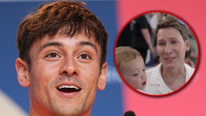 Tom Daley and husband and son