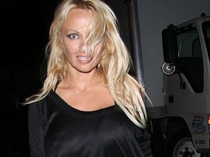 Pam Anderson in short black skirt