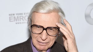 The Amazing Kreskin WEaring Glasses And Holding His Hand To His Head