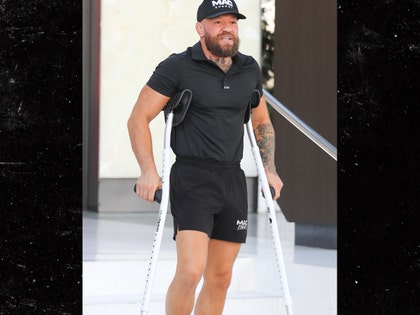 Connor McGregor seen with scarred leg backgrid