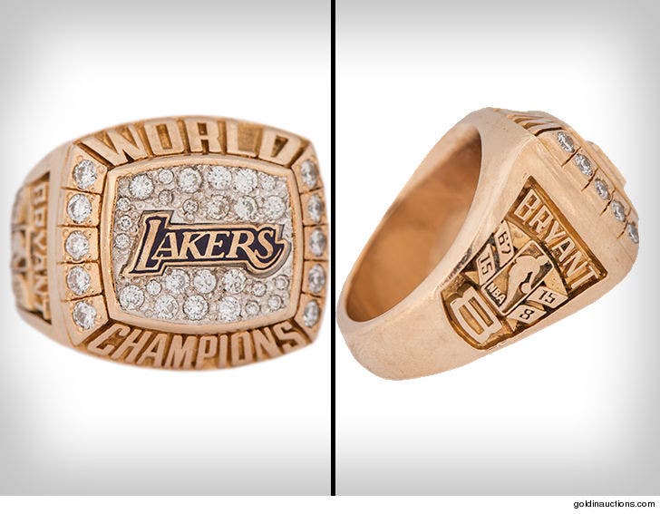 Kobe Bryant with Replica Lakers Championship Rings and Authenticated S –  Millionaire Gallery