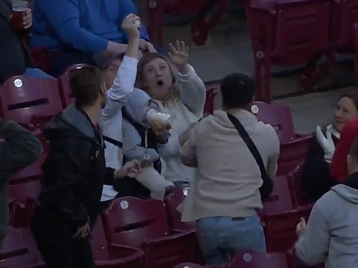 MLB Fan Amazingly Catches Foul Ball While Feeding Baby