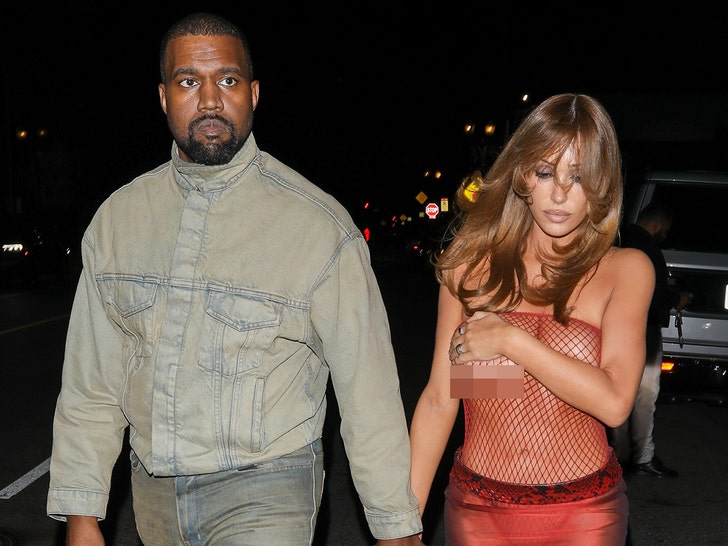 Bianca Censori Steps Out in Red Fishnet With Ye