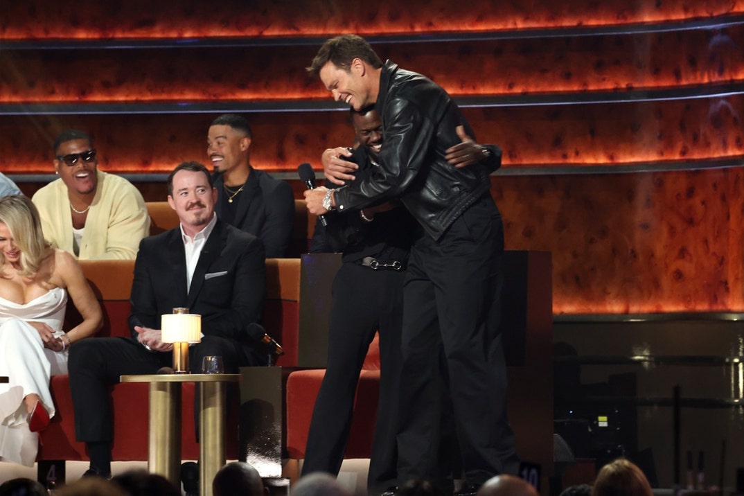 Kevin Hart and Tom Brady speak onstage during Netflix Is A Joke Festival Presents: The Roast of Kevin Hart