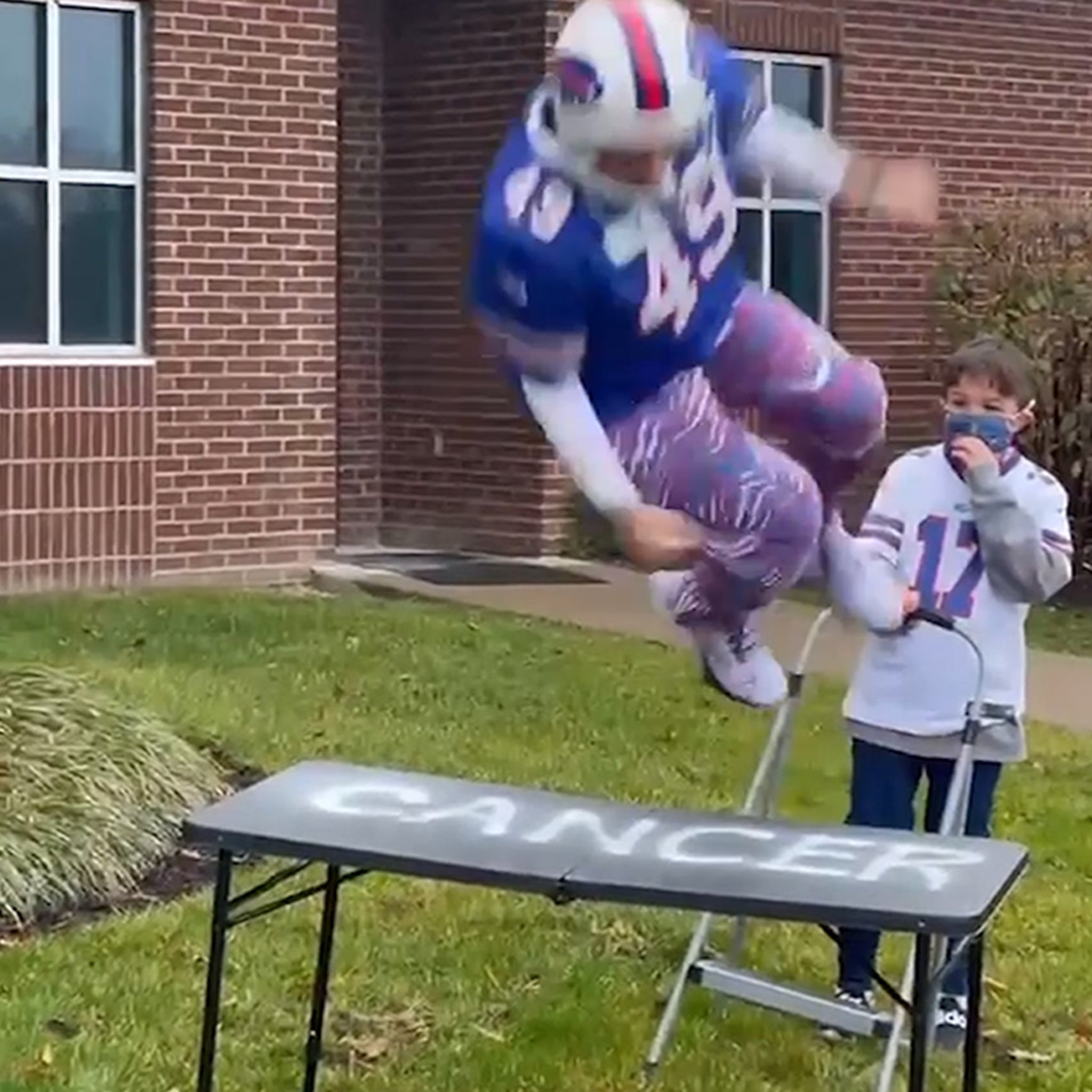 WATCH: One Bills fan slams another through folding table at