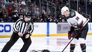 NHL Ref Stretchered Off Ice After Scary Collision With Player