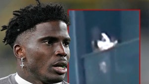tyreek hill baby over balcony main getty x composite