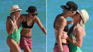 'RHOC' Star Braunwyn Windham-Burke Kisses Model GF on Beach