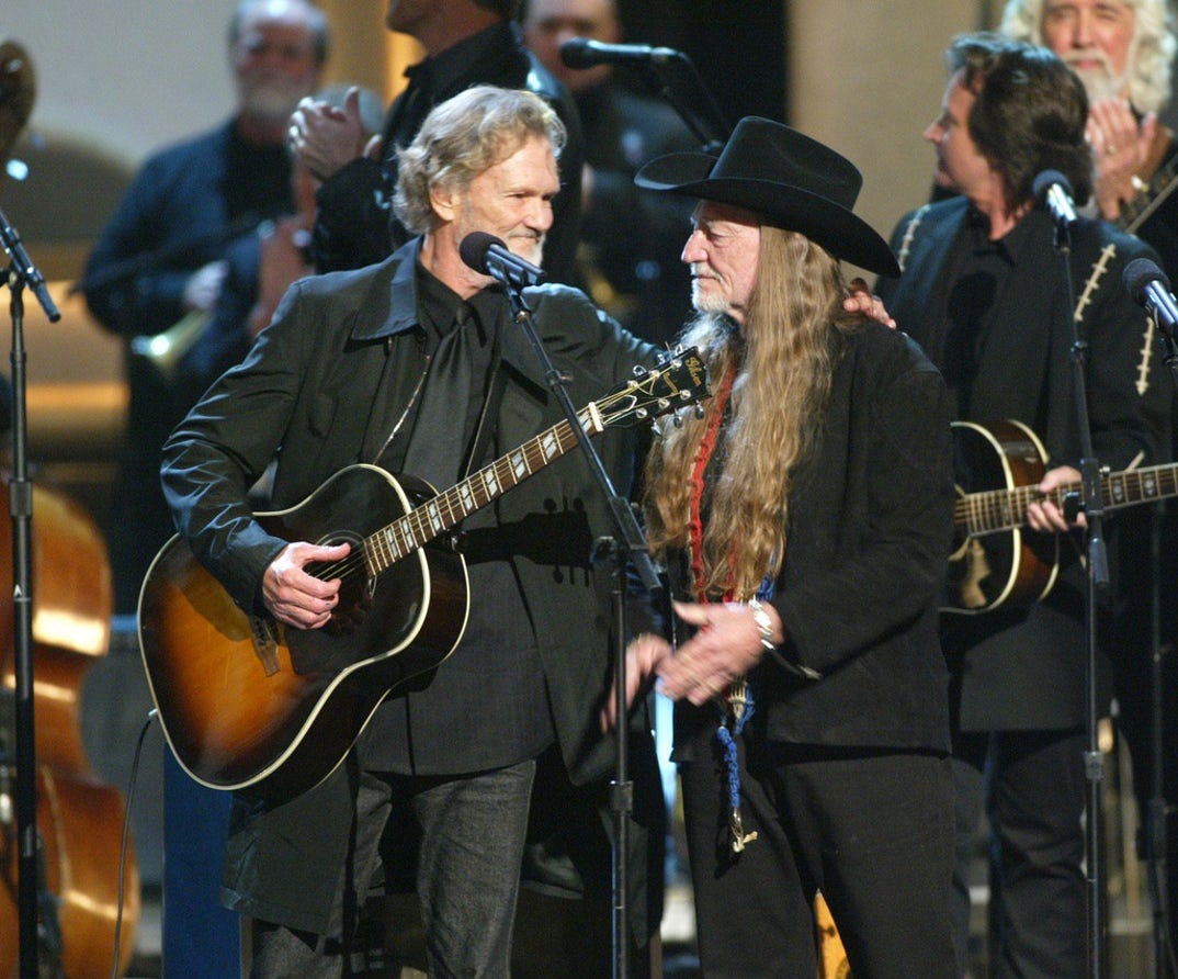 2003 - Kriss Kristofferson (L) and Willie Nelson (R) perform together in a tribute to Johnny Cash at the 37th CMA Awards.