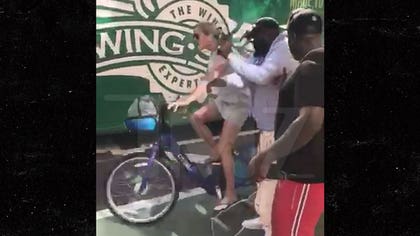 Nothing comes between Rick Ross and a plate of his delicious wings ... unless, of course, it's a NYC cyclist barreling down the street who damn near took out Da Boss!