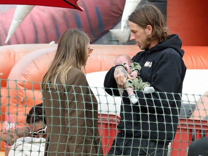 Frances Bean Cobain And Riley Hawk With Their Baby