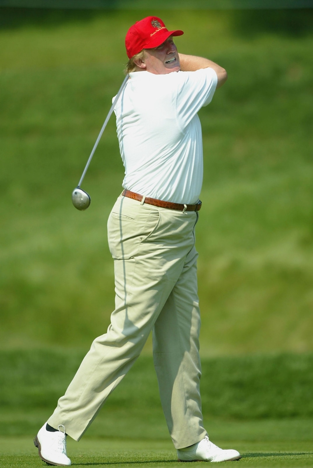 Donald Trump walks up the ninth fairway during the pro-am prior to the start of the Buick Classic at the Westchester Country Club in Harrison, New York.