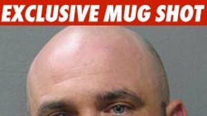 'Survivor' Villain -- Collared for Mug Shot