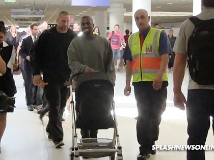 090814_kanye_west_stroller_splash_primary