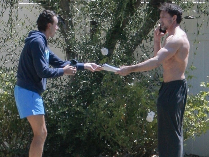 Aaron Phypers Receives Legal Papers Shirtless At Home in Calabasas