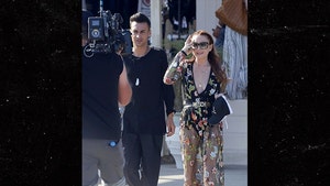 Lindsay Lohan Steps Out to Film Reality Show in Greece