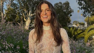 Rachel Yaffe Smiling In A Lace Shirt