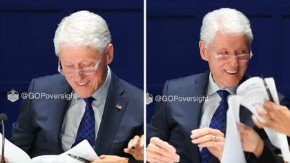 030326_bill_clinton_laughing_depo_kal