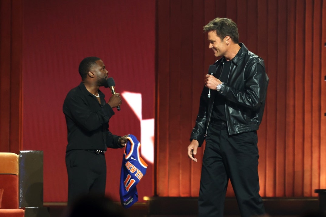 Kevin Hart and Tom Brady speak onstage during Netflix Is A Joke Festival Presents: The Roast of Kevin Hart