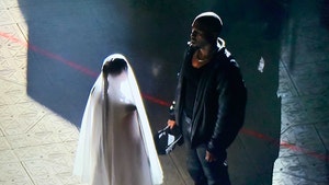 Kim Kardashian Wears Wedding Dress, Joins Kanye at 'Donda' Event