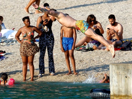 0717-Conor-McGregor-Diving-Shirtless-Beach-France-Family-Photos-primary-2
